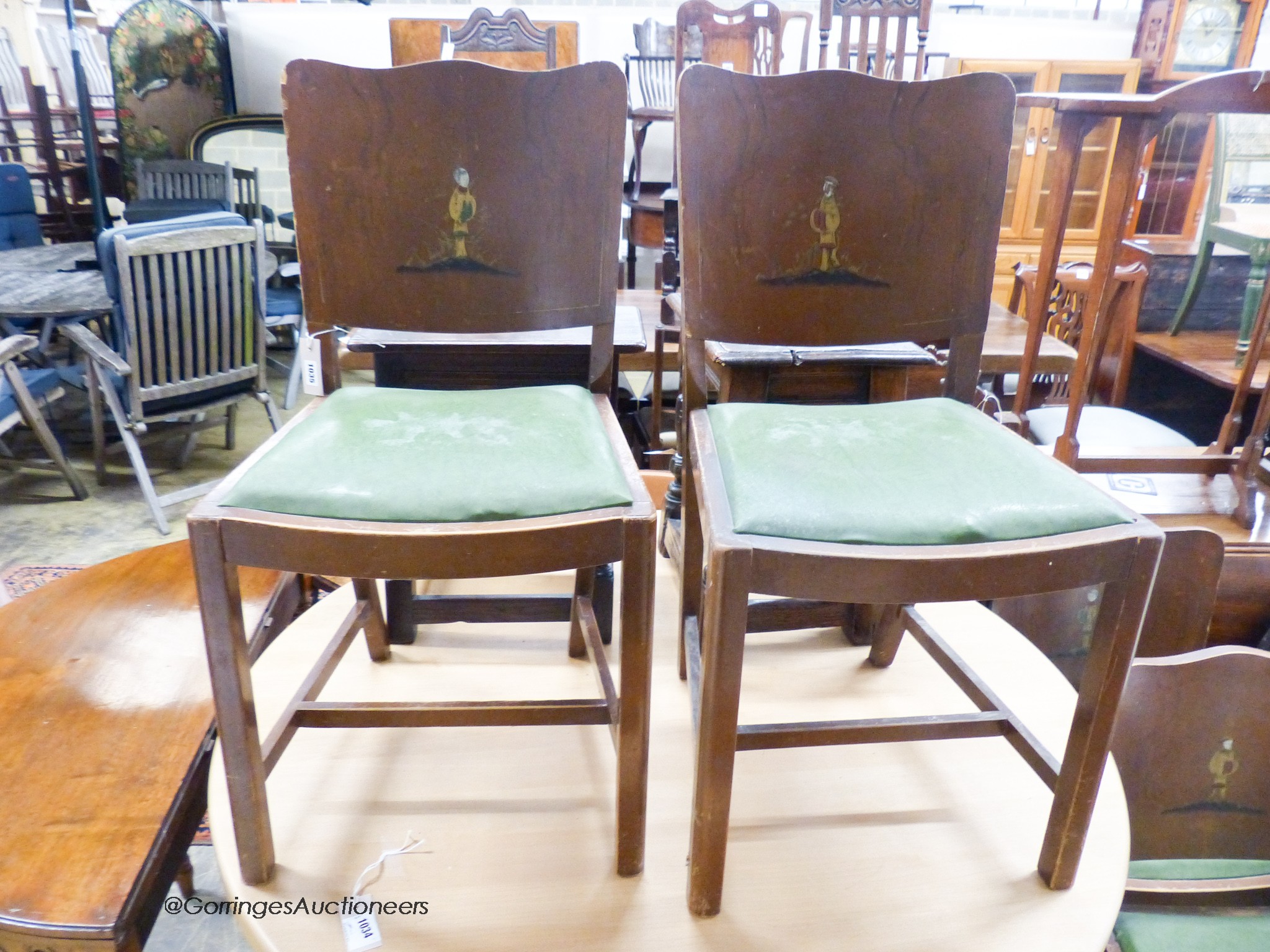 A set of four 1920's chinoiserie lacquer dining chairs